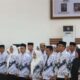 Bupati Ismet Mile saat mengukuhkan dan melantik pengurus PGRI Bone Bolango Masa Bakti V Periode 2025-2030, di Aula BPMP Provinsi Gorontalo, Kamis (24/7/2025). (F.Onal/Prokopim)