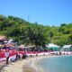 Pencanangan gerakan pembagian Bendera Merah Putih bersama Forum Kewaspadaan Dini Masyarakat (FKDM) dan Lintas Organisasi Kemasyarakatan se-Provinsi Gorontalo, di Pantai Modelomo Kecamatan Kabila Bone, Sabtu (2/8/2025). (F.Onal/Prokopim)/Ulanda.id