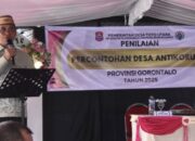 Sekretaris Daerah Bone Bolango, Iwan Mustapa saat menghadiri dan memberikan sambutan pada Penilaian Percontohan Desa Antikorupsi Provinsi Gorontalo di Desa Toto Utara, Kamis (9/10/2025). (F.AKP-Diskominfo)/Ulanda.id